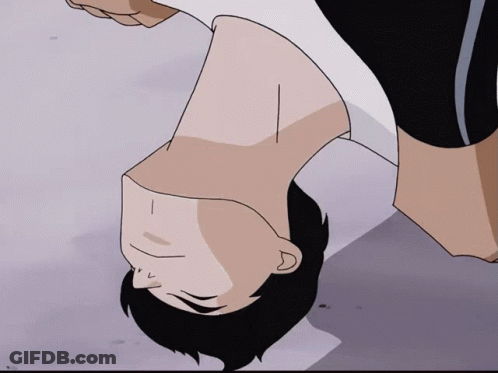 Man In Wig Making Funny Face By Flower Wall GIF