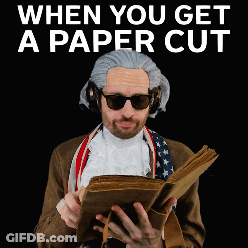 Man In Wig Reading 'When You Get A Paper Cut GIF