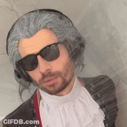 Man In Wig, Sunglasses, And Headphones GIF