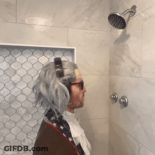 Man In Wig Taking Shower GIF