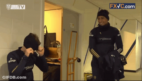 Man In Williams Jacket Next To Another Man GIF
