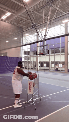 Man In Wilson Jersey Holding Basketball GIF