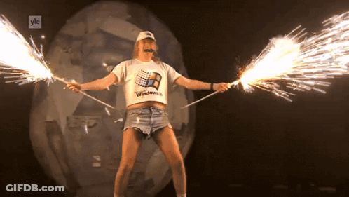 Man In Windows T-Shirt Holding Sparklers GIF