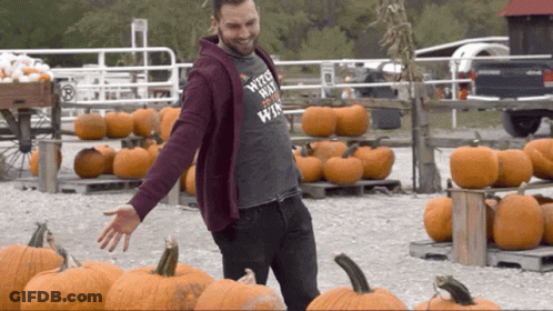 Man In Witch Shirt With Pumpkins GIF