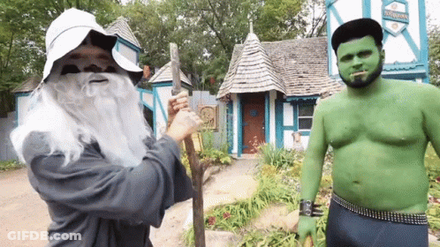 Man In Wizard Costume Next To Green Orc GIF