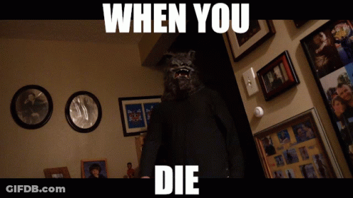 Man In Wolf Mask In Front Of Wall With Pictures Saying When You Die GIF