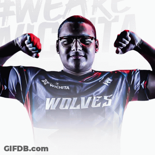 Man In Wolf Shirt Flexing Muscles GIF