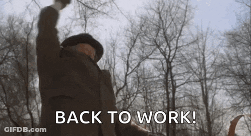 Man In Woods With Fist In Air Saying Back To Work GIF