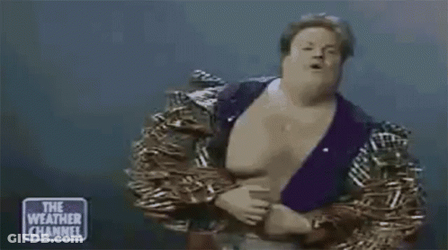 Man In Wrestling Outfit Standing On Stage GIF