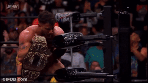 Man In Wrestling Ring Holding AEW Belt GIF