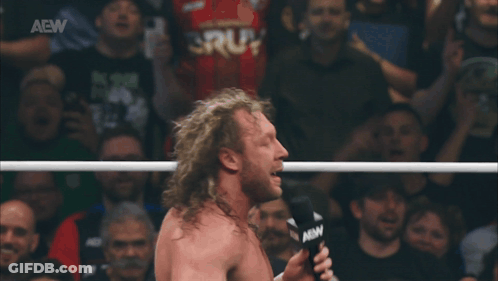 Man In Wrestling Ring Holding AEW Microphone GIF