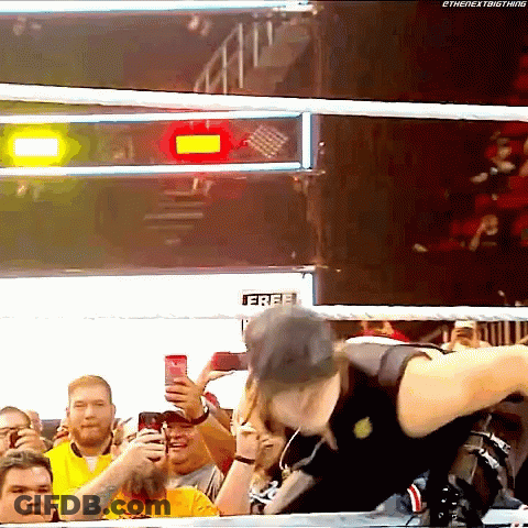 Man In Wrestling Ring Holding Free Sign GIF