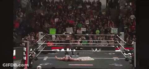 Man In Wrestling Ring Holding I Love You Sign GIF