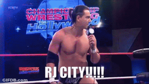 Man In Wrestling Ring Holding Microphone Saying RJ City GIF