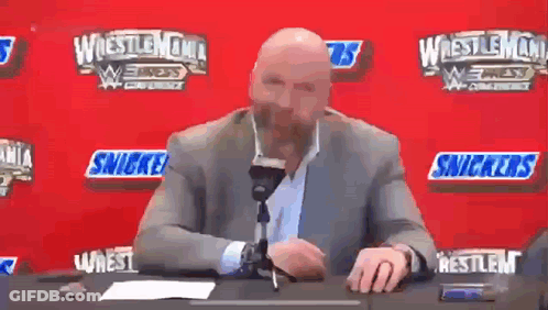 Man In Wrestling Ring Holding Microphone Saying RJ City GIF