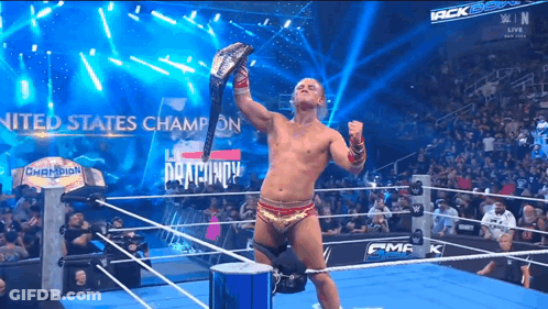 Man In Wrestling Ring Holding US Champion Belt GIF