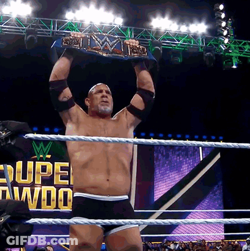 Man In Wrestling Ring Holding WWE Championship Belt GIF