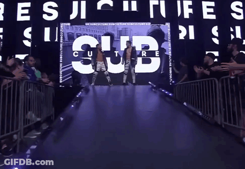 Man In Wrestling Ring Surrounded By Collage GIF