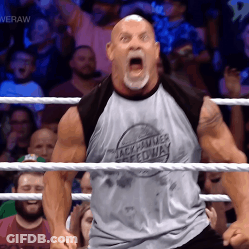 Man In Wrestling Ring Wearing Rock Hammer Speedway Shirt GIF