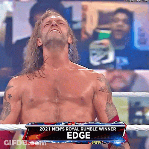Man In Wrestling Ring With 2021 Men's Royal Rumble Winner Sign GIF