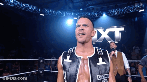 Man In Wrestling Ring With Absolute Vest GIF
