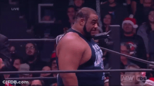 Man In Wrestling Ring With AEW Shirt GIF