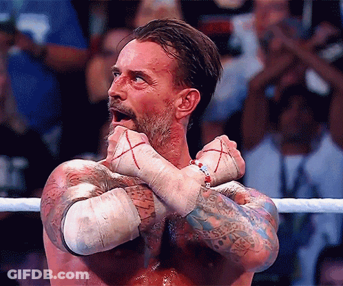 Man In Wrestling Ring With Arms Crossed And Bracelet GIF