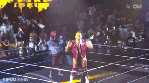 Man In Wrestling Ring With CW Logo GIF