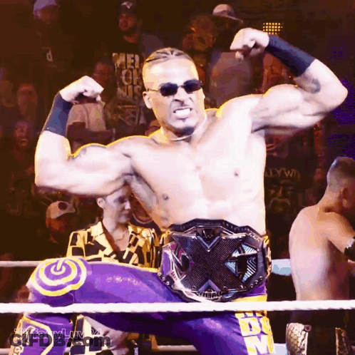 Man In Wrestling Ring With DDS Belt GIF