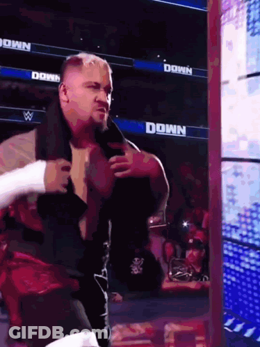 Man In Wrestling Ring With Down Sign GIF