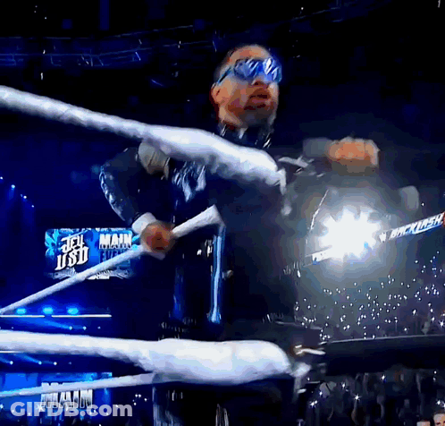 Man In Wrestling Ring With Jet Usd Sign GIF