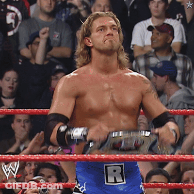 Man In Wrestling Ring With Letter R On Belt GIF