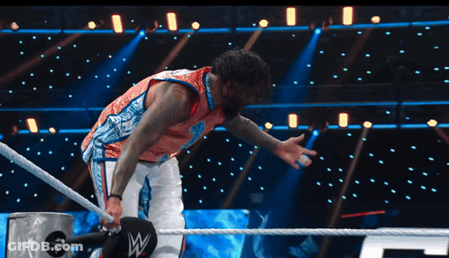 Man In Wrestling Ring With Letter W On Ropes GIF