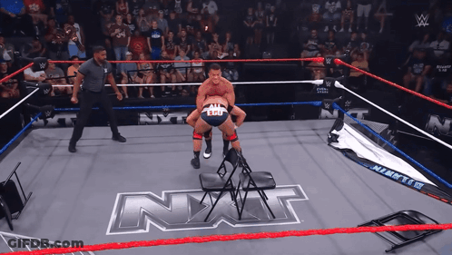Man In Wrestling Ring With NXT GIF