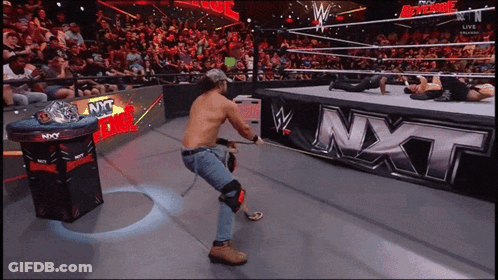 Man In Wrestling Ring With NXT Sign GIF
