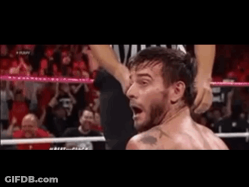 Man In Wrestling Ring With Referee GIF