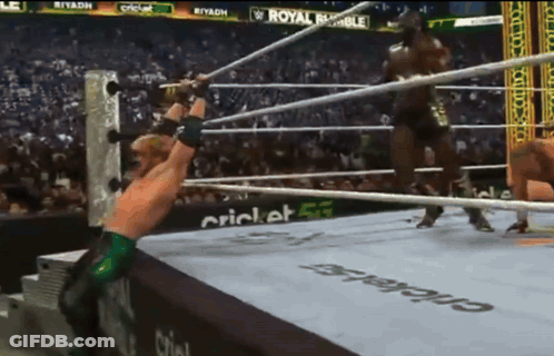Man In Wrestling Ring With Royal Rumble Ad GIF