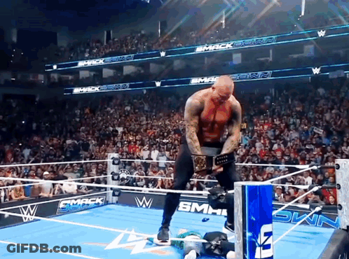 Man In Wrestling Ring With Smack Down Sign GIF