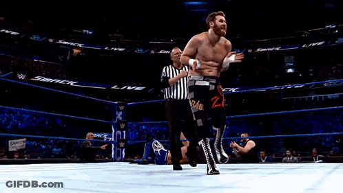 Man In Wrestling Ring With Smack On Walls GIF