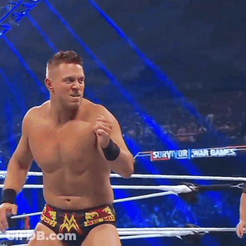 Man In Wrestling Ring With Survivor Banner GIF