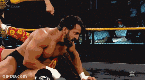 Man In Wrestling Ring With W Logo GIF