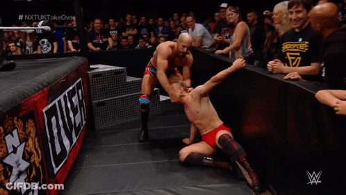 Man In Wrestling Ring With W Logo GIF