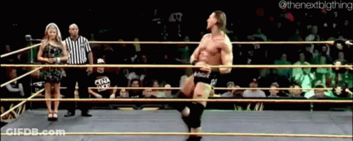 Man In Wrestling Ring With Woman Behind Nextbigthing GIF