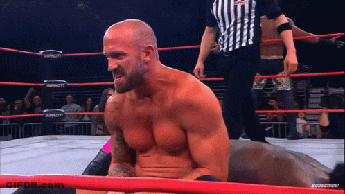 Man In Wrestling Ring With Word Impact GIF