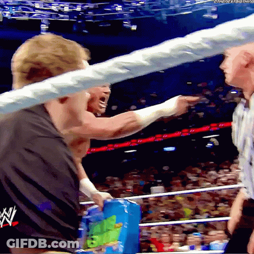 Man In Wrestling Ring With WWE Logo GIF