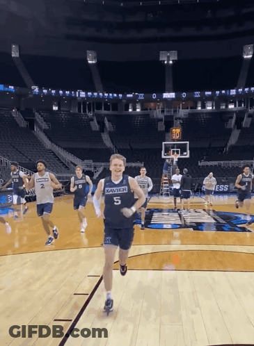 Man In Xavier Jersey Running On Court GIF