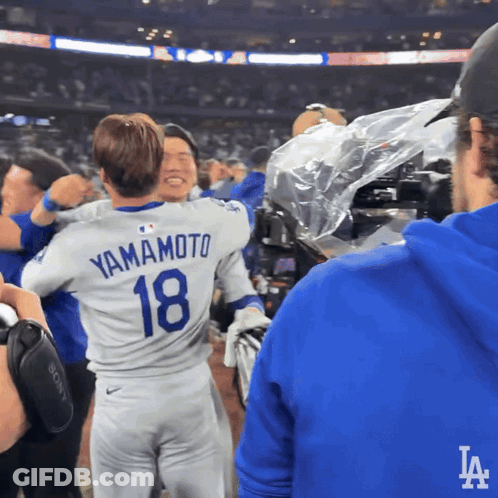 Man In Yamamoto 18 Jersey Hugging Another Man GIF