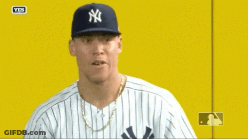 Man In Yankees Hat And Striped Shirt GIF