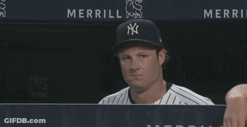 Man In Yankees Hat Looking At Camera GIF