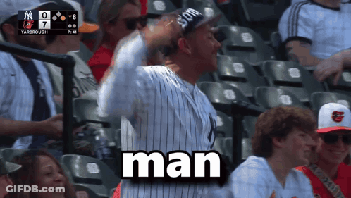 Man In Yankees Hat Sitting In Stadium Says Man GIF